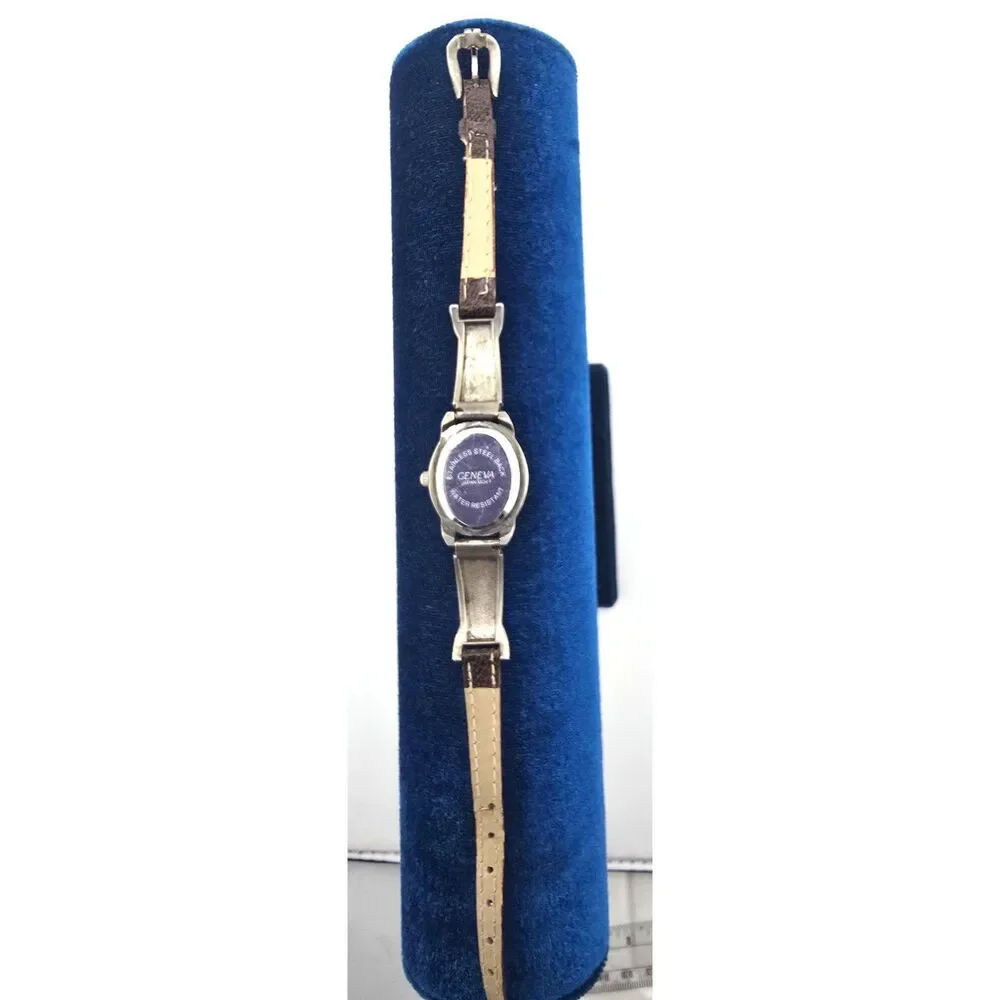 Woman's Geneva Silver Tone Oval Quartz Watch Ornate Bracelet Silver Tone
